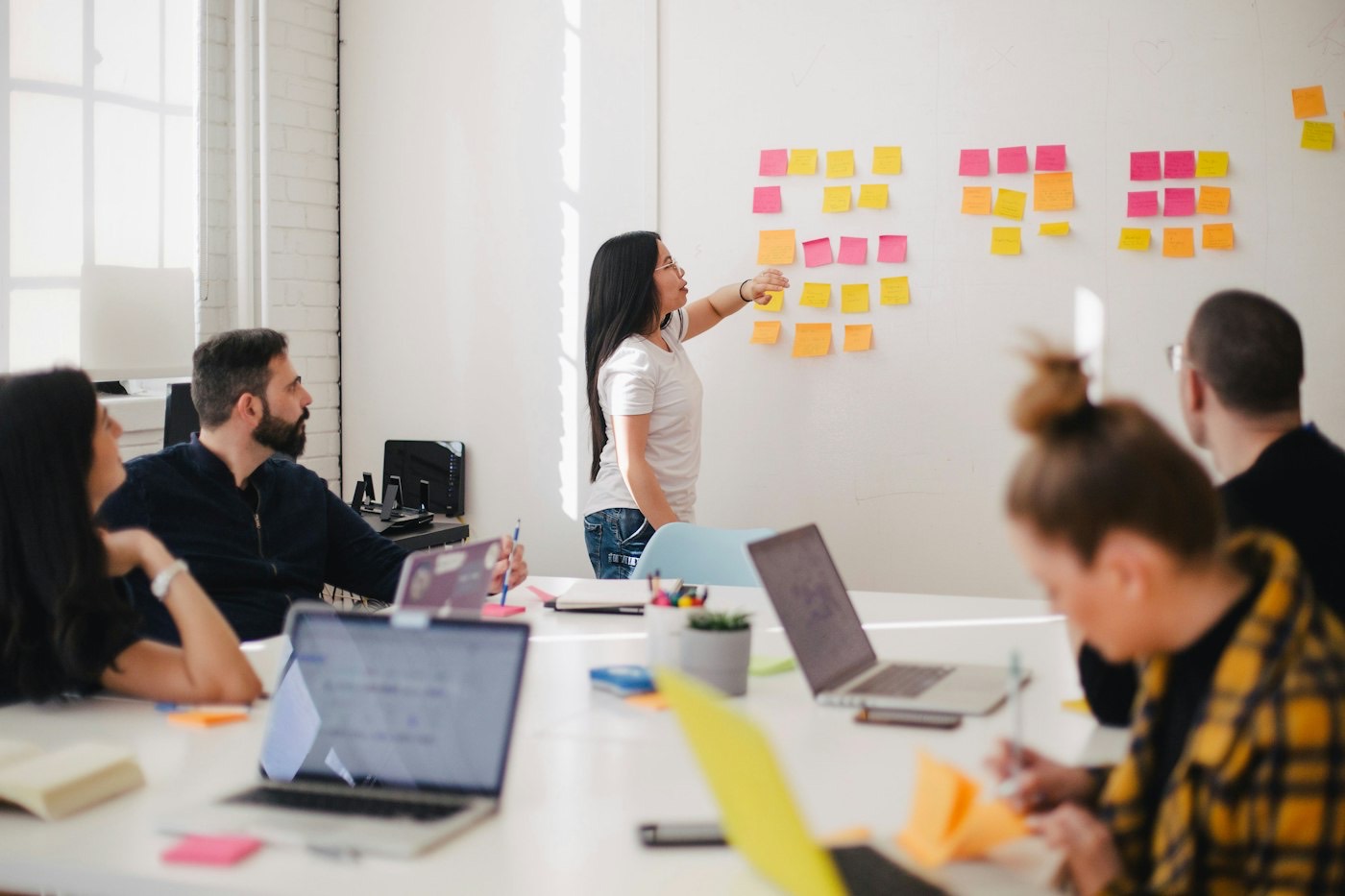 A team mapping ideas on a whiteboard during a planning workshop